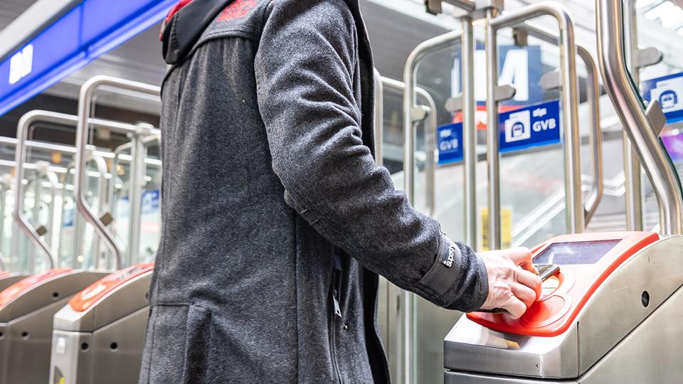 OVpay man in tram with debit card